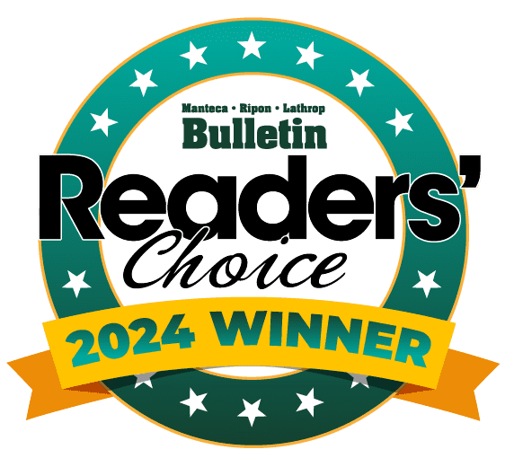 A circular badge with white stars on a green border reads Manteca Ripon Lathrop Bulletin Readers Choice 2024 Winner in bold black and yellow text, with a yellow ribbon at the bottom. | California Urgent Care Center