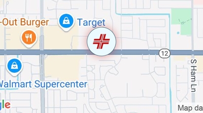 A map showing icons for In-N-Out Burger, Target, and Walmart Supercenter along a main road labeled as 12, with a red medical symbol centered on the map near S Ham Ln. | California Urgent Care Center