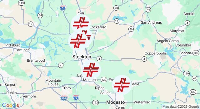 A map of California’s Central Valley shows several red hospital symbols clustered around Stockton, Lodi, and Modesto, indicating hospital locations along Highway 99 and I-5. | California Urgent Care Center